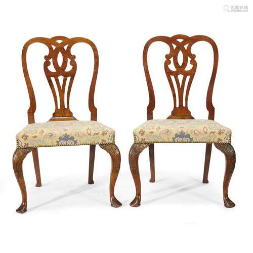 A pair of George I carved walnut side chairs circa