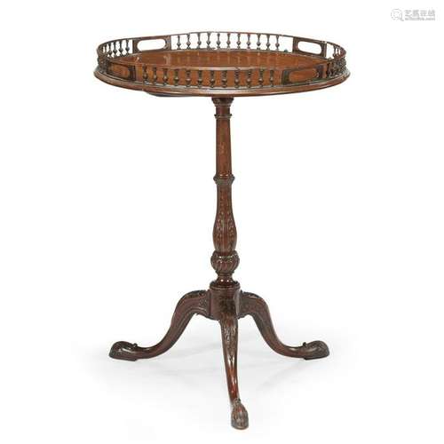 A George III mahogany galleried flip-top kettle stand