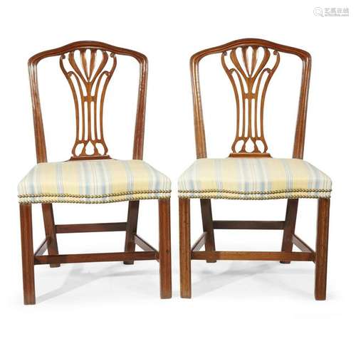 A pair of George III carved mahogany side chairs late