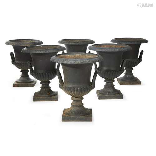 Six cast iron garden urns 20th century H: 23, W: 20 in.