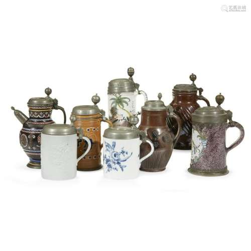 Eight Continental pewter-mounted steins mostly German