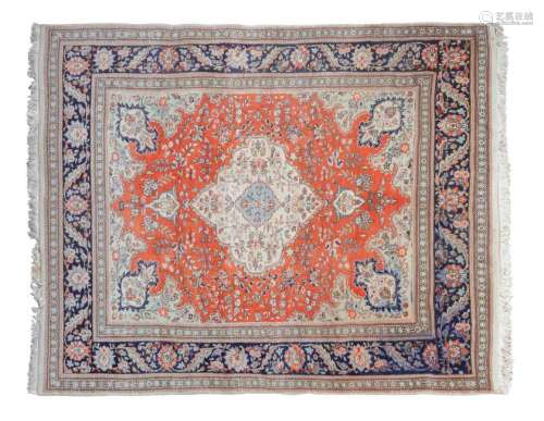 A Tabriz Carpet 9 feet 9 inches x 6 feet 11 inches.