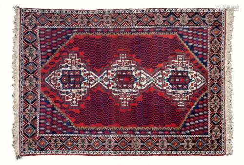 A Persian Rug 83 1/2 x 59 1/2 inches.