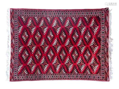 A Persian Wool and Silk Rug 7 feet 3 inches x 5 feet 3