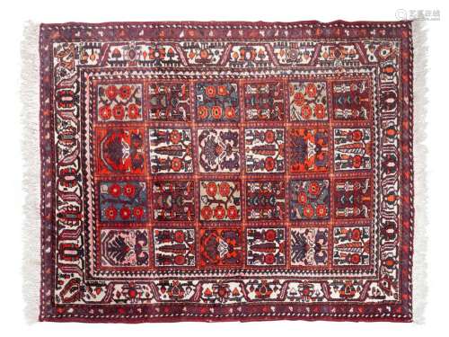 A Bokhara Wool Rug 6 feet 7 1/2 inches x 5 feet 3