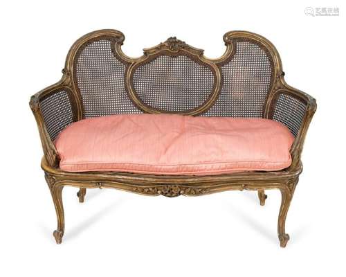 A Louis XV Style Giltwood and Caned Canape Height 35 x