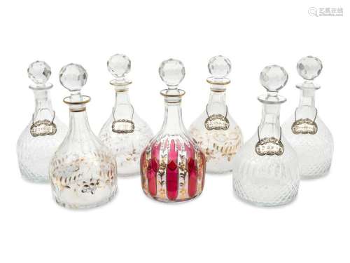 A Group of Seven Large Glass Decanters Height of