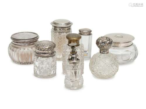 A Group of Six Silver or Brass Capped Glass Bottles and
