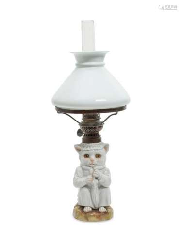 Â A German Porcelain Oil Lamp Height 15 3/4 inches.