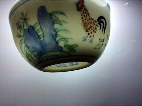 Chinese cup in blue and white with over glaze colors