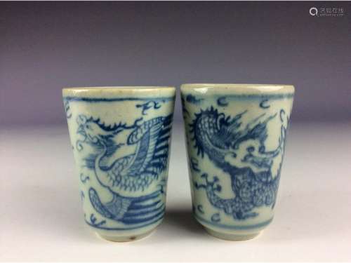 A pair of Chinese B/W cups decorated with dragon and