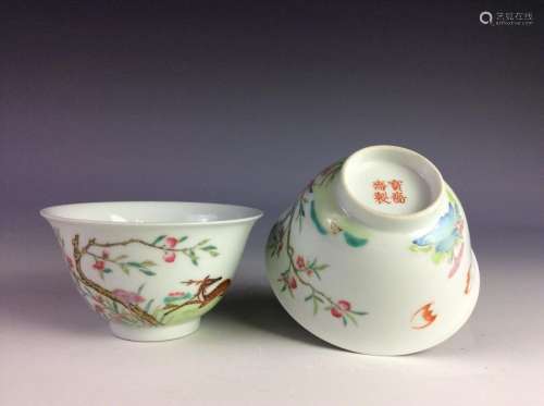 A pair of Chinese famille rose bowls, decorated,