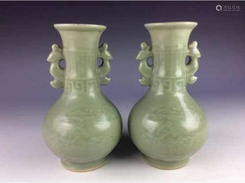 Pair of Chinese celadon vases with double handles.