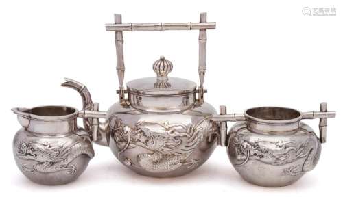 A late 19th century Chinese silver three-piece tea service, maker Wang Hing & Co,