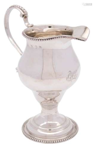 A George III silver pedestal cream jug, maker's mark worn probably Nathaniel Appleton & Ann Smith,