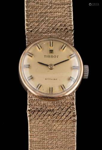 A lady's 9ct gold 'Tissot' wristwatch: the dial with baton makers and on mesh-link strap,