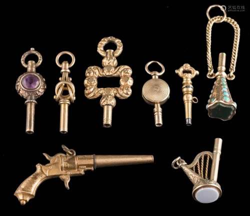 A 19th century gold plated 'revolver' watch key,