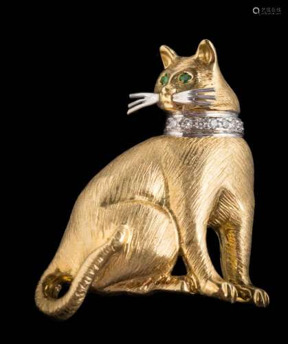 An emerald and diamond mounted 'cat' brooch: stamped '18K', the seated cat with prominent whiskers,