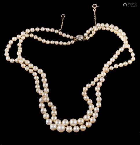 A graduated cultured pearl two-string necklace: with strings composed of 73 and 74 cultured pearls