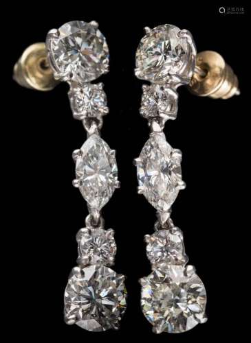 A pair of diamond pendant drop earrings: each with a lower brilliant-cut diamond drop of 1.