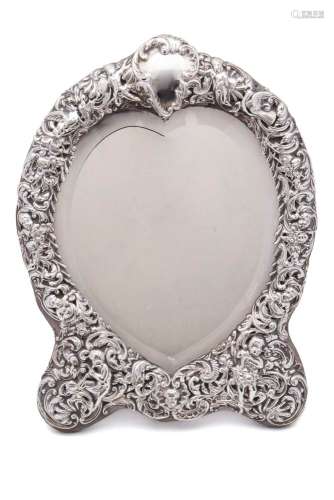 An Edward VII silver easel dressing table mirror, maker WC, London, 1909: of heart-shaped outline,
