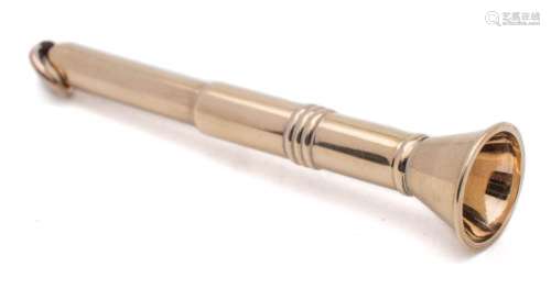 A 9ct gold cigar piercer: of trumpet-shaped outline, 6.5cm, long, 8.06gms.