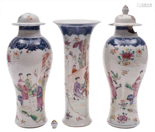 A garniture of three Chinese porcelain vases: comprising a trumpet vase and two baluster vases and