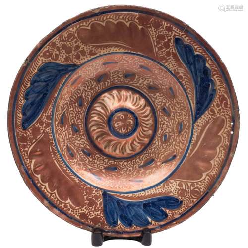 A Hispano Moresque charger: probably Manises of circular form with an embossed rim and central boss