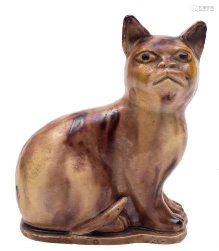 A Whieldon-style lead glazed pottery model of a cat: seated on its haunches and covered with