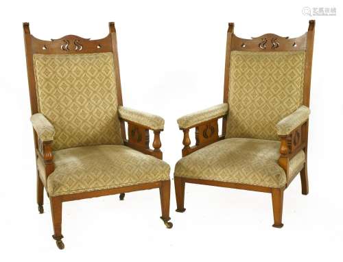A pair of Arts and Crafts oak armchairs,