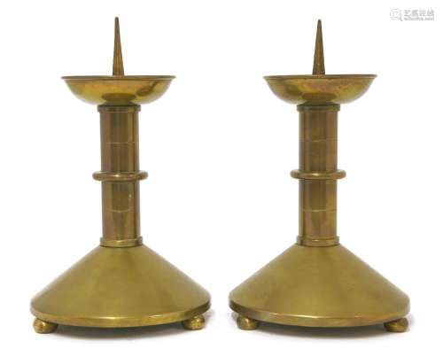 A pair of brass pricket candlesticks,