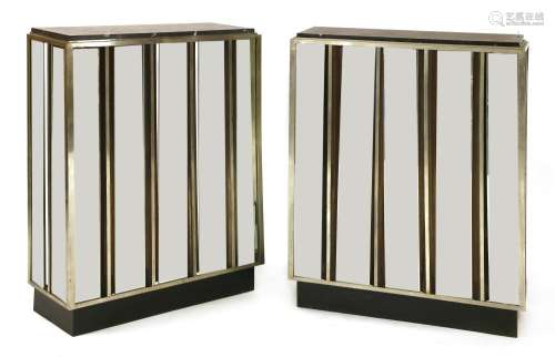 A pair of mirrored consoles,