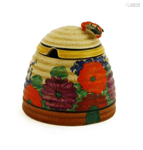A Clarice Cliff 'Gayday' Beehive honeypot and cover,