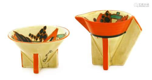 A Clarice Cliff 'Red Trees and House' conical sugar bowl and cream jug,