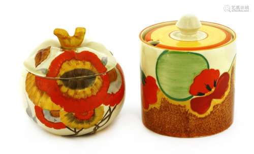 Two Clarice Cliff preserve pots and covers,