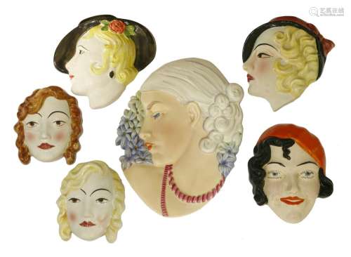 Six Art Deco pottery wall masks,