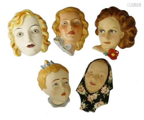 Five Art Deco pottery wall masks,