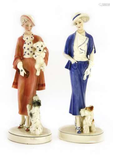 Two Katzhütte figures of ladies with dogs,
