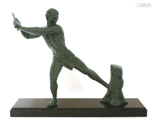 An Art Deco spelter figure of a man with an axe,