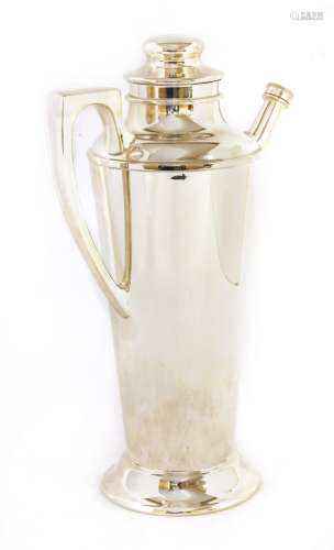 A silver-plated cocktail shaker,