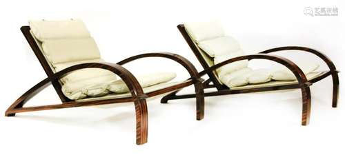 A pair of Macassar lounge chairs,