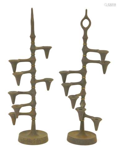 A pair of cast iron candle trees,