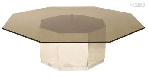 An octagonal glass coffee table,