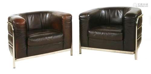 A pair of leather club chairs,