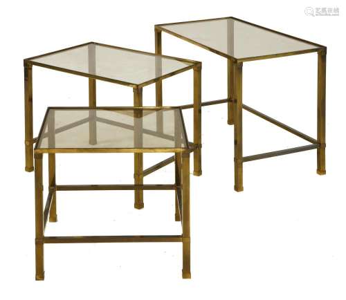 A nest of three brass tables,