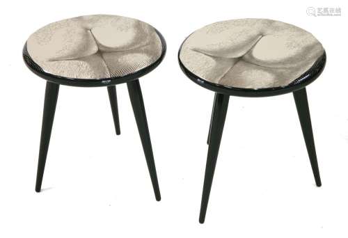 A pair of 'Tergonomico' low stools,