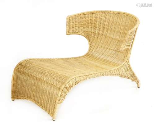 A rattan lounge chair,