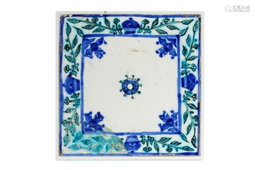 A BLUE AND TURQUOISE-PAINTED KUTAHYA POTTERY TILE