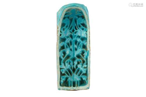 A TURQUOISE-GLAZED CARVED POTTERY NICHE TILE (MUQARNAS)