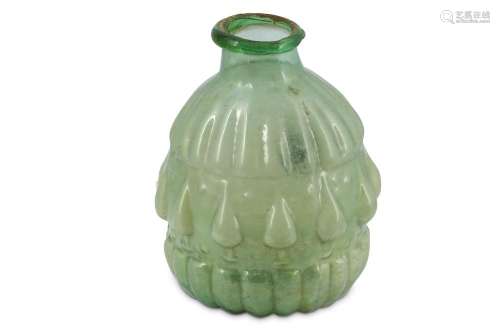 A MOULD-BLOWN LIGHT GREEN GLASS VASE